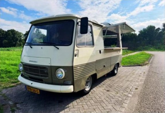 Retro Peugeot J7 food truck in cream and olive green