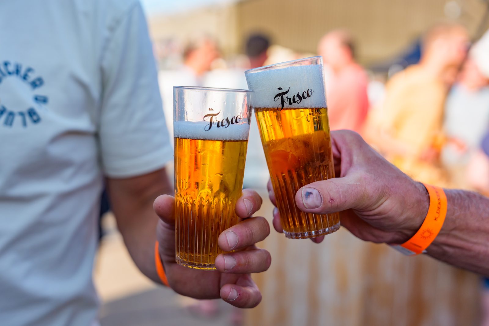 Cheers with beer in Mr. Fresco cups